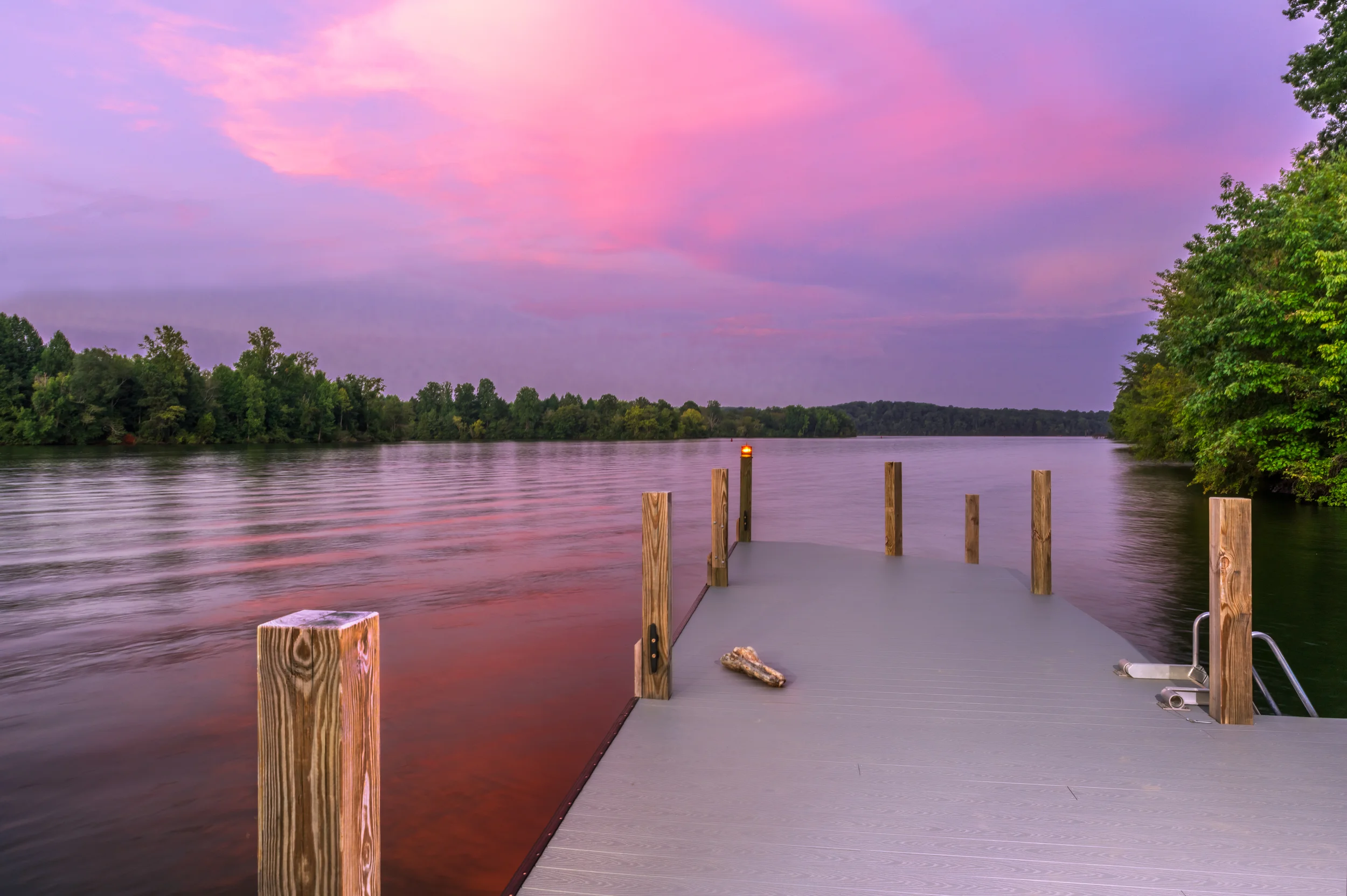 Chairs, american flags, fishing poles and swimming gear on a dock in Soddy Daisy, Tennessee.