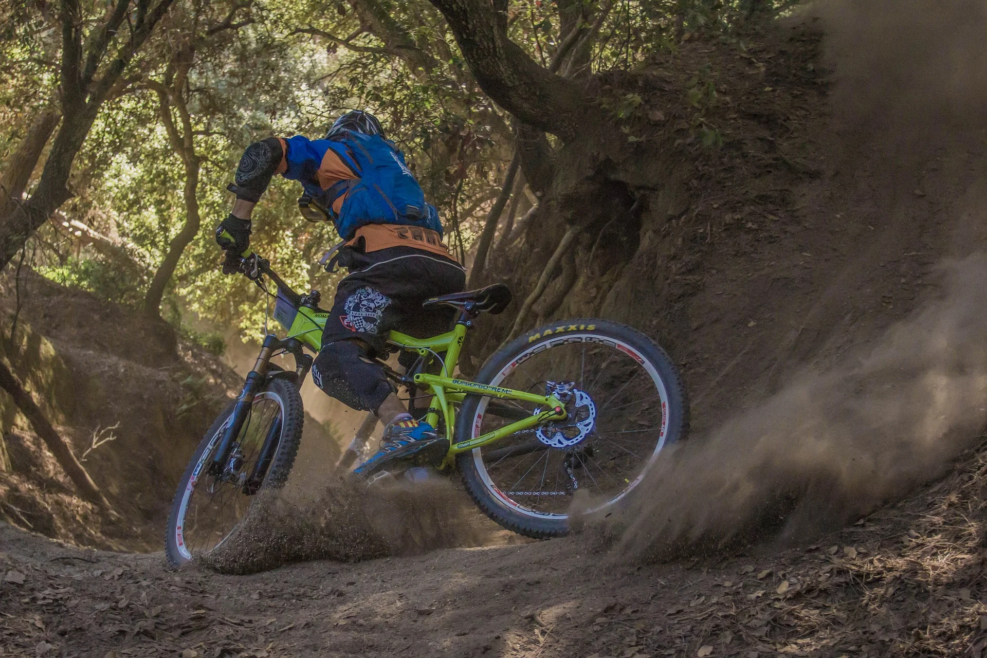 mountain biker riding down trail